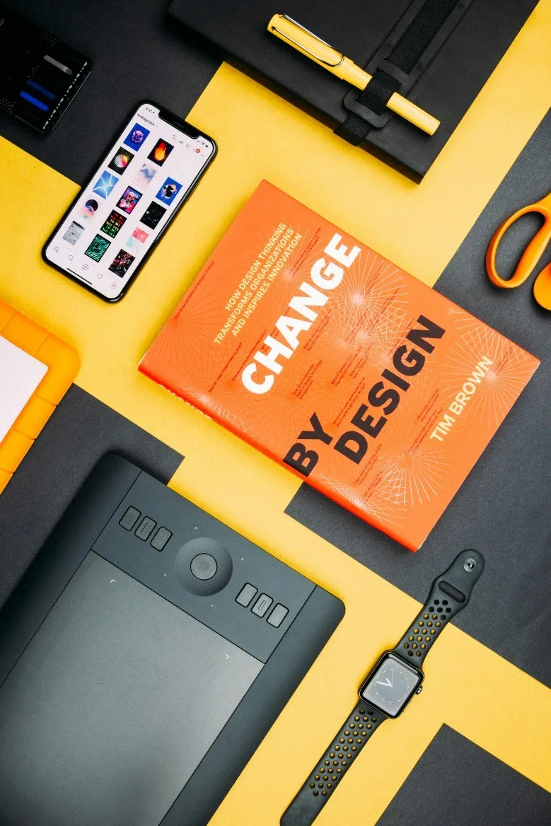Change by Design book on a yellow desk